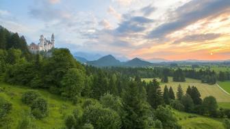 Majestic Beauty of Neuschwanstein Castle at Sunset wallpaper