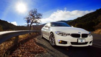 Sleek White BMW on Scenic Drive wallpaper