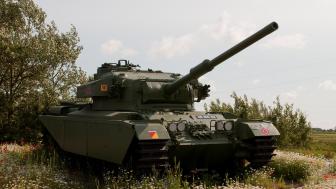 Majestic Military Tank in Natural Landscape wallpaper