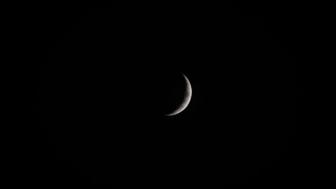 Crescent Moon in a Cosmic Sea wallpaper