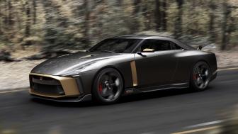 Nissan GT-R50 Speeding through a Forest Road wallpaper