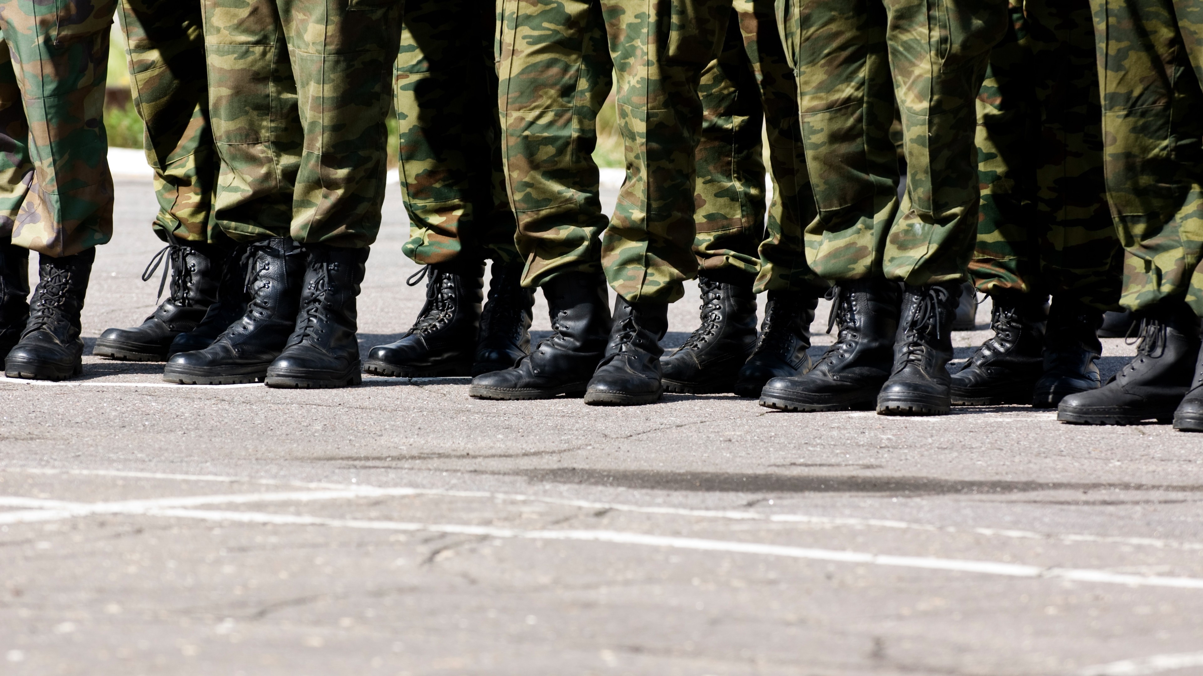 Boots on Parade Military Formation in Camouflage Uniforms 4K - backiee