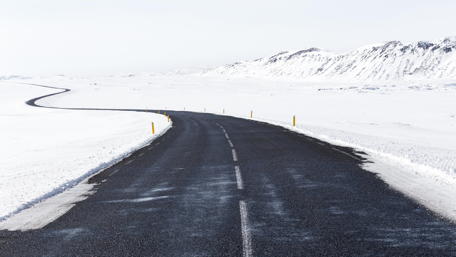 Endless Road Through the Snowy Horizon wallpaper