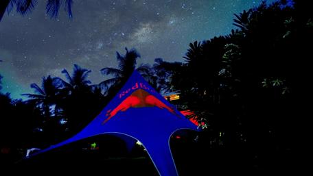 Vivid Night Under the Stars with Red Bull Banner wallpaper