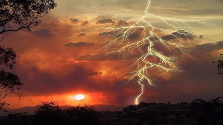 Thunderstorm over Fiery Sunset wallpaper