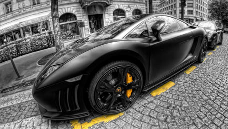 Sleek Monochrome Lamborghini on City Streets wallpaper