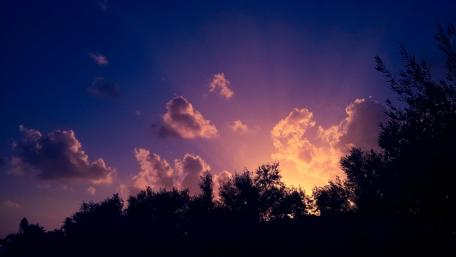 Serene Sunset Over a Tranquil Landscape wallpaper