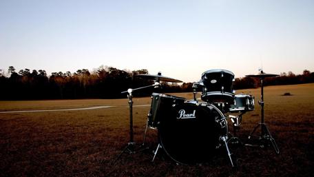 Drums at Dusk: A Serene Musical Setup wallpaper