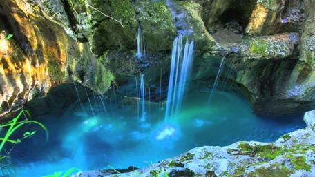 Mesmerizing Blue Waterfall Scene wallpaper