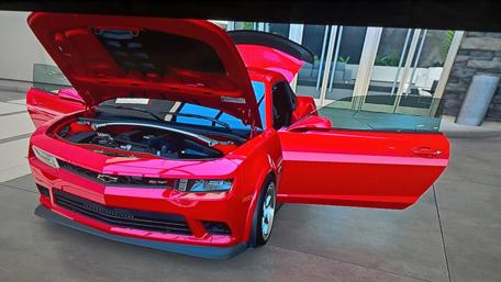 Sleek Red Muscle Car Wallpaper wallpaper