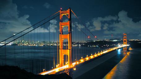 Golden Bridge Illuminated at Night for Urban Serenity wallpaper