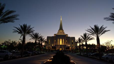 Majestic Temple at Dusk Near Lush Palm Trees wallpaper