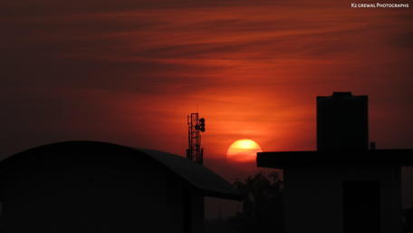 Golden Sunset Over Urban Skyline wallpaper