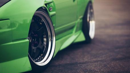 Vibrant Green Car Close-Up Shot wallpaper