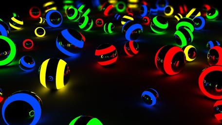 Vibrant Neon Spheres in Dynamic Motion wallpaper