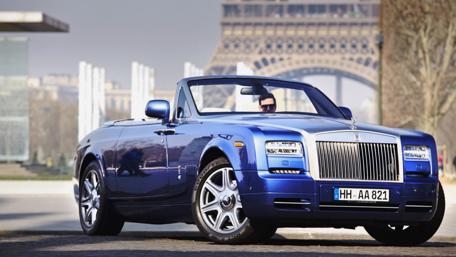 Elegant Blue Rolls Royce Ghost Convertible by Iconic Landmark wallpaper