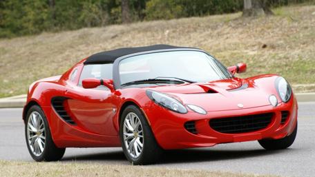 Sleek Red Lotus Elise Driving into Adventure wallpaper