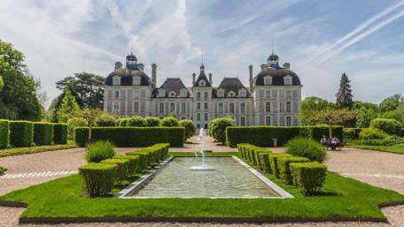 Majestic Chateau Surrounded by Lush Gardens and Serenity wallpaper