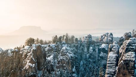 Majestic Winter Landscape Over Snowy Mountains wallpaper