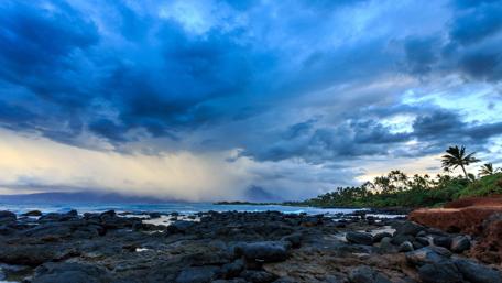 Serene Coastal Landscape Under Dramatic Skies wallpaper