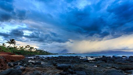 Serene Coastal Landscape Under Dramatic Skies wallpaper