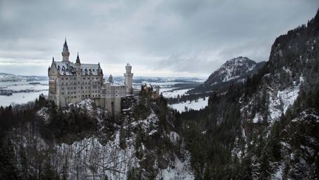 Majestic Castle Amongst Winter Peaks wallpaper