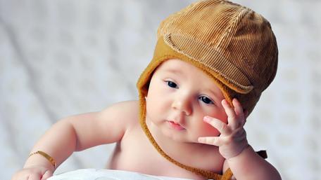 Charming Baby in a Cozy Hat wallpaper