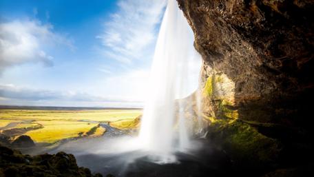 Stunning Waterfall Amidst Lush Landscapes wallpaper