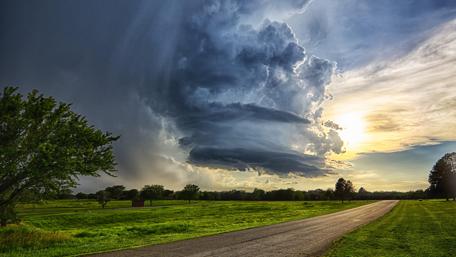 Storm Brewing Over Green Fields wallpaper