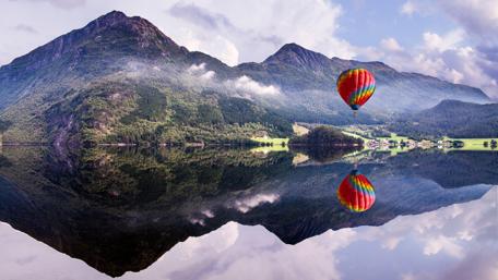 Majestic Serenity of a Hot Air Balloon Reflection wallpaper