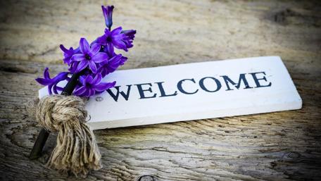 Welcome Sign with Purple Flowers wallpaper