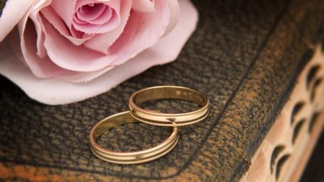 Golden Rings on a Floral Background for Wedding Memories wallpaper