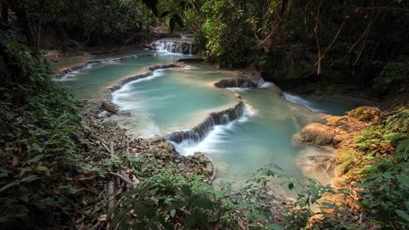 Enchanting Cascades in Lush Wilderness wallpaper