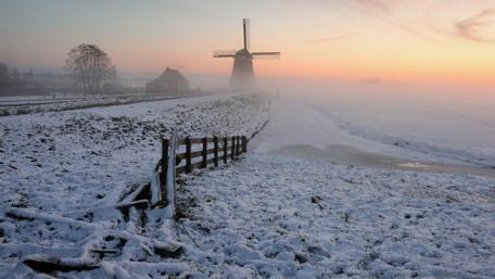 Frozen Sunrise Over a Snowy Mill Landscape wallpaper