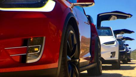 Sleek Cars Under Clear Blue Sky wallpaper