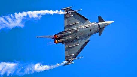 Soaring Power: A Military Jet in Action wallpaper