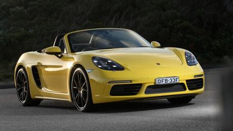 Vibrant Yellow Convertible Sports Car Wallpaper wallpaper