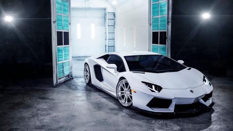 Sleek White Dream Car in Modern Studio Setting wallpaper