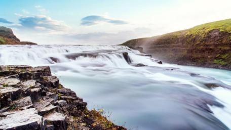 Serene Waterfall in a Tranquil Landscape wallpaper