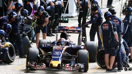 Fast-Paced Formula 1 Pit Stop Action wallpaper