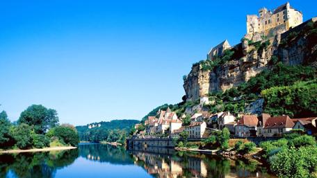 Serene Lake with Majestic Castle and Mountains wallpaper