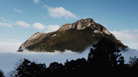 Majestic Mountain Peaks above the Clouds wallpaper