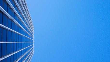 Modern Skyscraper Against a Clear Blue Sky wallpaper