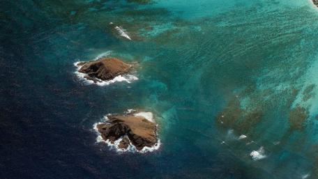 Serene Aerial View of Tropical Islands and Turquoise Waters wallpaper