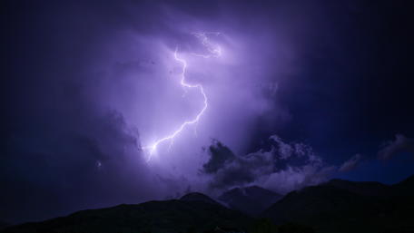 Majestic Night Sky Illuminated by Lightning wallpaper