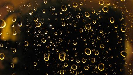 Golden Drops on Glass Surface wallpaper