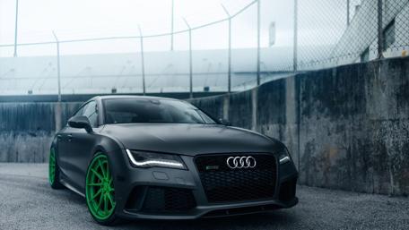 Sleek Audi with Vibrant Green Wheels wallpaper