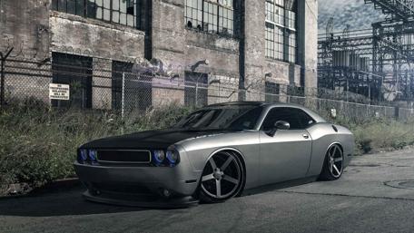 Sleek Vintage Car Against Urban Backdrop wallpaper