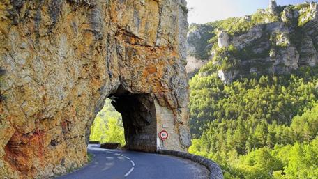 Majestic Rock Formation on Scenic Roadway wallpaper