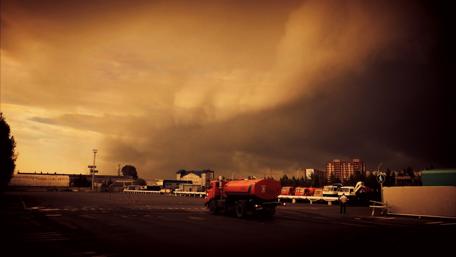 Dramatic Cityscape Under Stormy Skies wallpaper